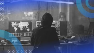 A hacker at a computer. XDR, or extended detection and response, can help detect and thwart cyberattacks.