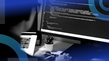 A software developer writing code on a computer