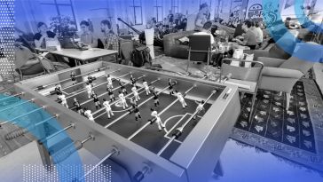 Startup workers in an office with a giant ping-pong table in the foreground.