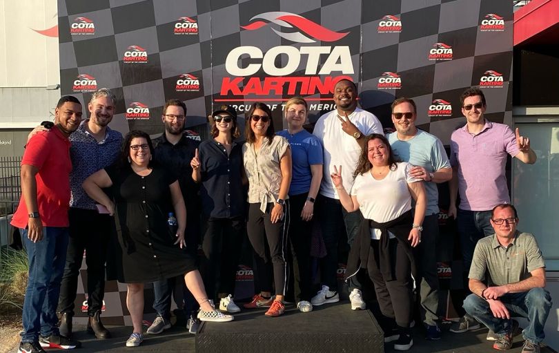 Arrive team members at a go-kart racing track